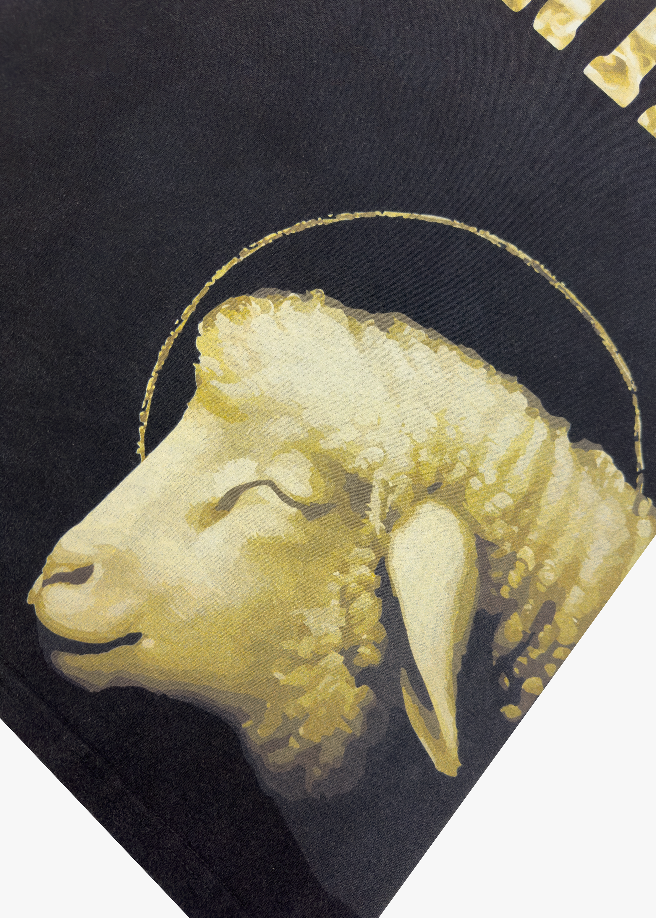 Close-up of lamb graphic on Sacred Lamb Tee - OMERTA
